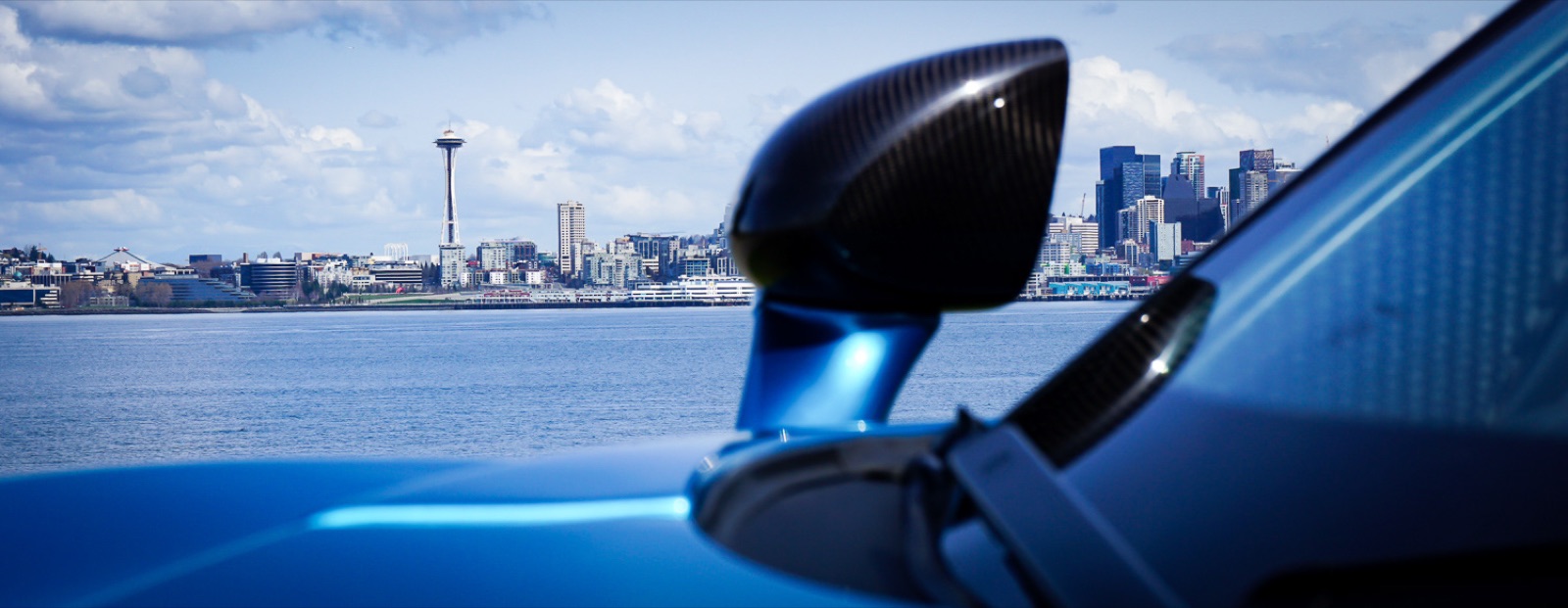 McLaren mirror against the Seattle skyline